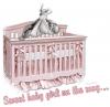 baby with pink crib
