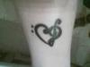 Heart musical note tattoo