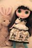 Cute black haired doll with a bunny