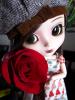 Cute Brunette blythe doll with a rose