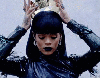 Rihanna putting on a crown