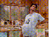 man walking with shirt saying "Bun In The Oven"