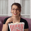 lady laughing eating popcorn